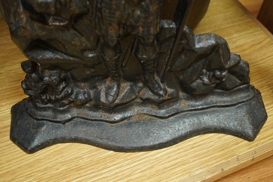 A collection of metalware to include a Victorian copper pan, a figural cast iron doorstop- 39cm high, brass door handles etc